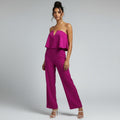 a woman in a pink romper on a white background
