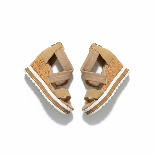 Pair of tan sandals with white soles on a white background