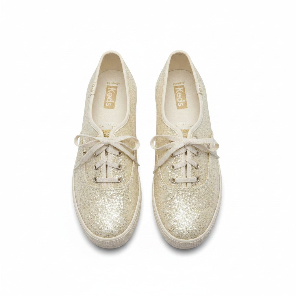 Pair of glittery white sneakers with white laces on a white background