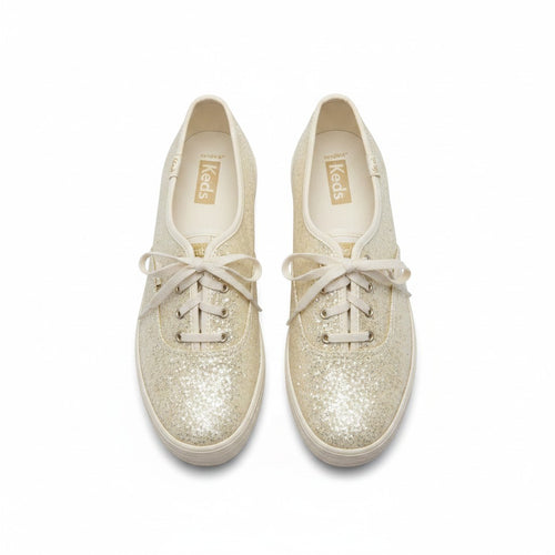 Pair of glittery white sneakers with white laces on a white background