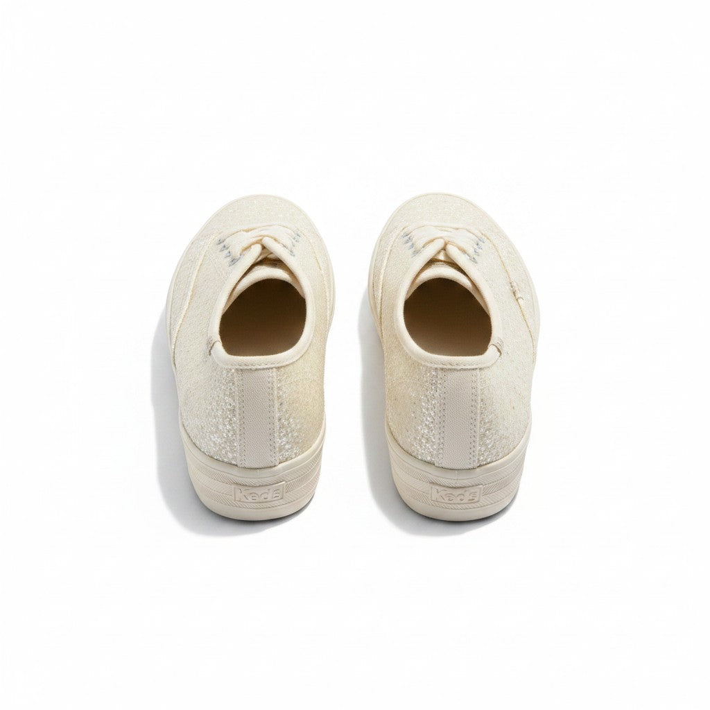 Pair of white sneakers on a white background