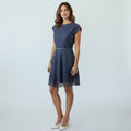 Woman wearing a blue dress on a white background