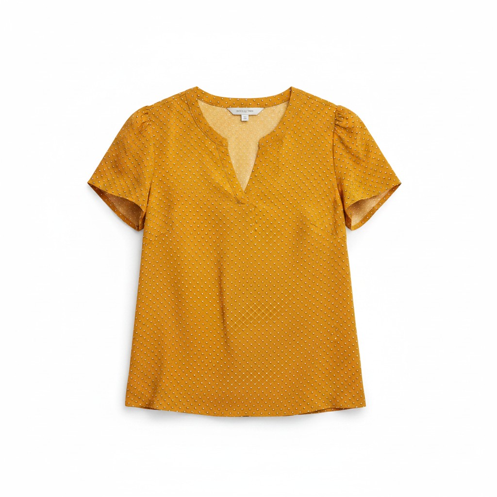 Yellow blouse with a subtle pattern on a white background