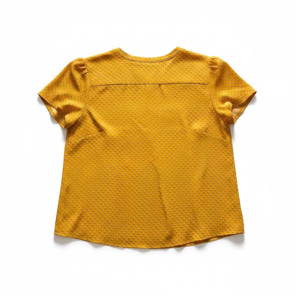 Yellow textured shirt on a white background