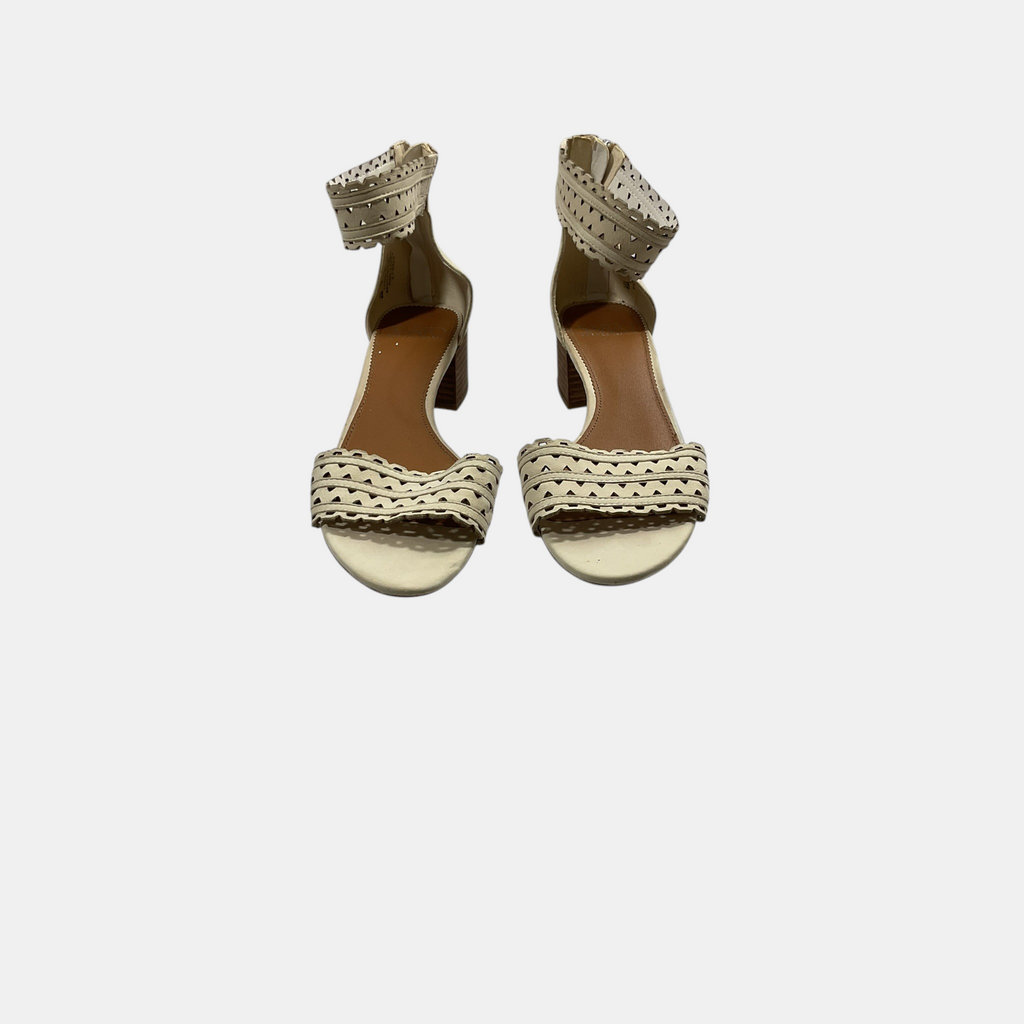 beige ankle strap sandals on a white background