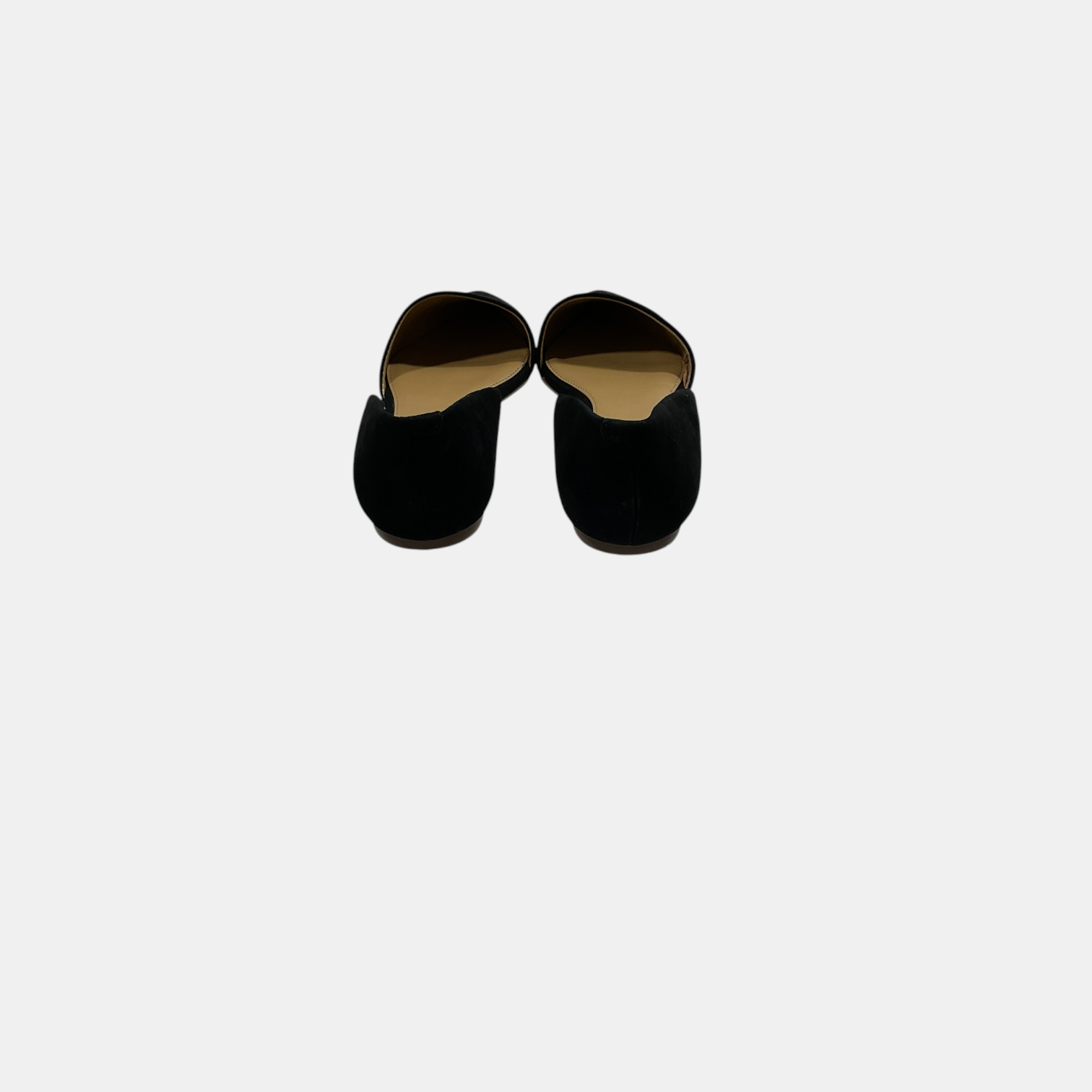 Pair of black slippers on a white background