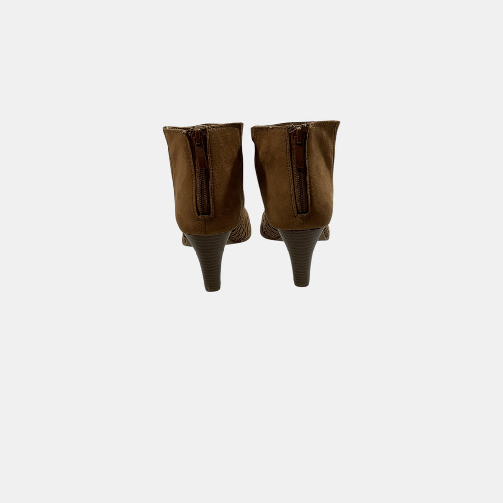 brown peep toe booties on a white background