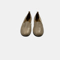 tan leather loafer on a white background