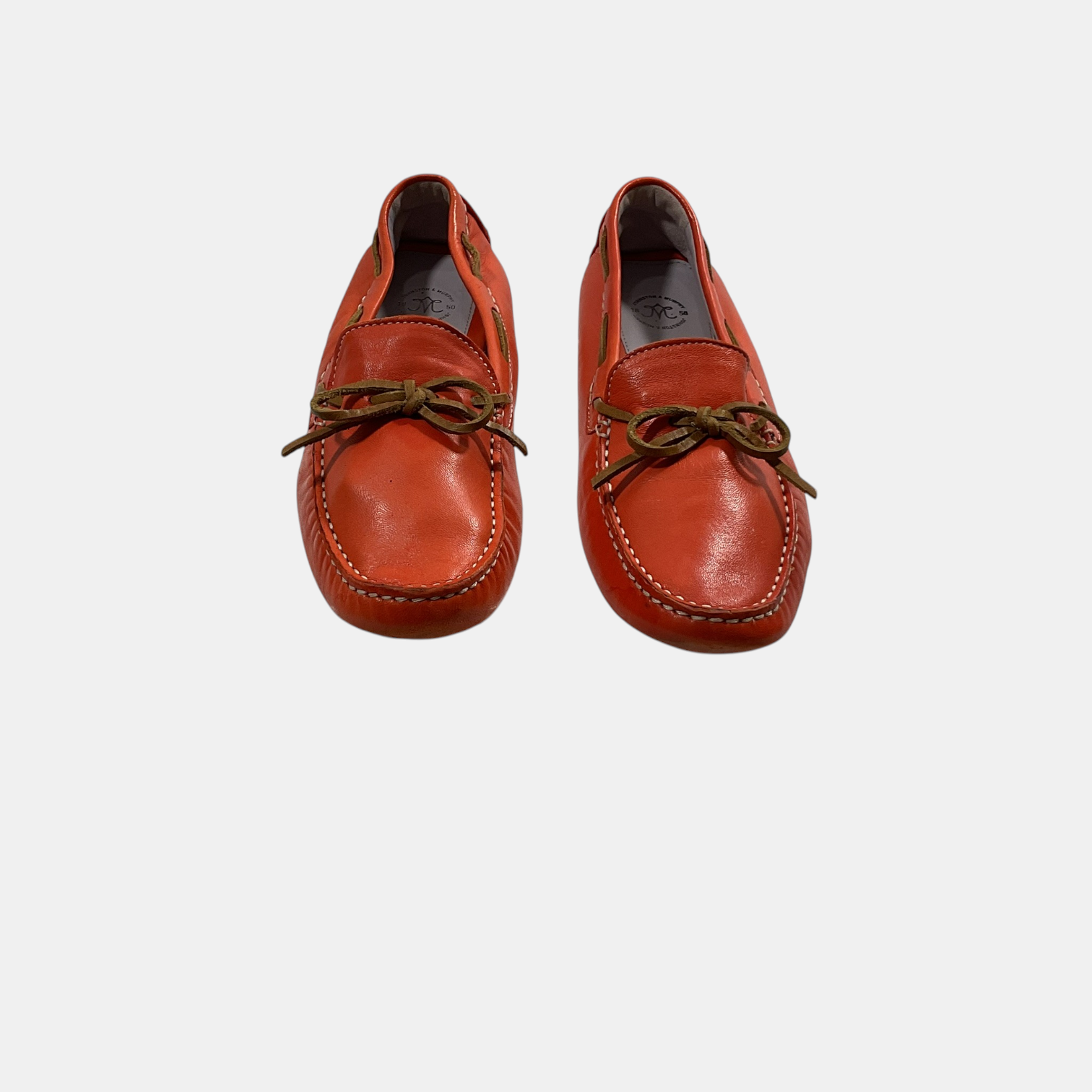 orange Johnston & Murphy loafers on a white background