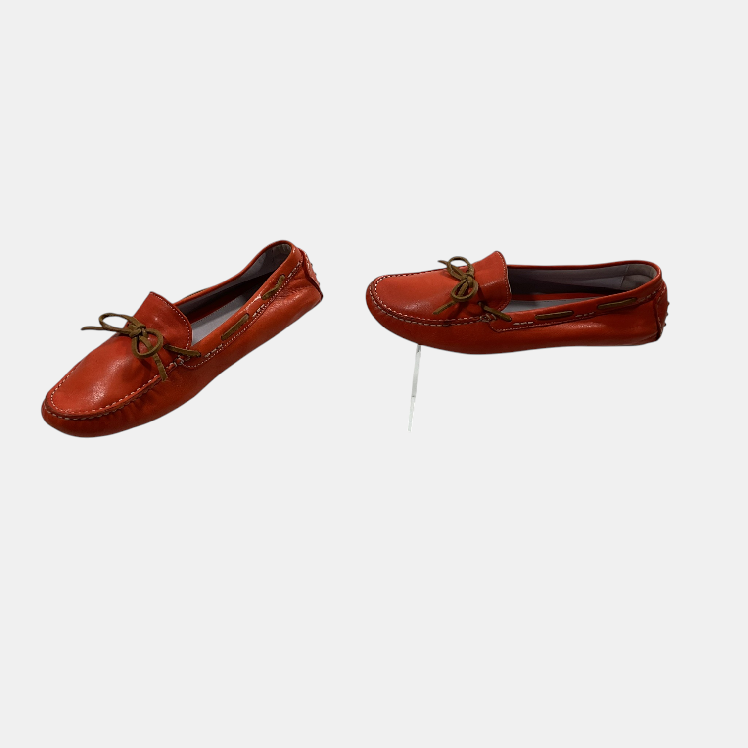 orange Johnston & Murphy loafers on a white background