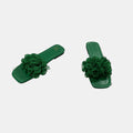 green slide on sandal on a white background
