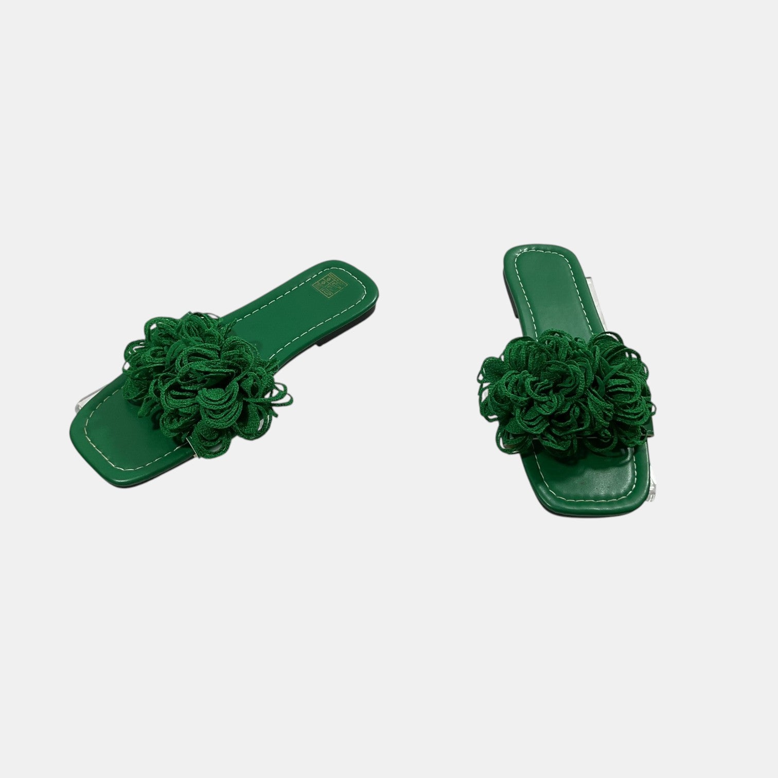green slide on sandal on a white background