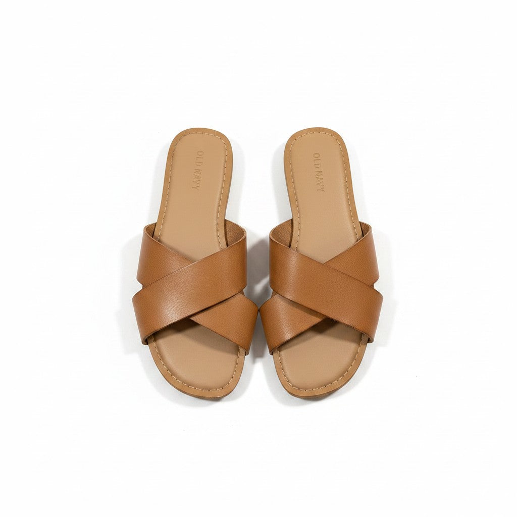 Pair of brown sandals on a white background