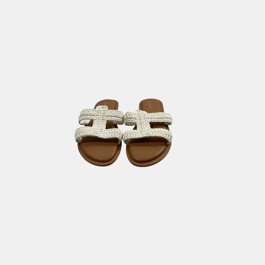 Black face mask with a logo on a white background