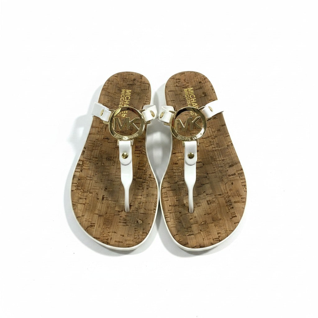 Pair of sandals with cork sole and gold logo on a white background