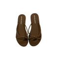 Brown sandals with 'Volcom' branding on a white background