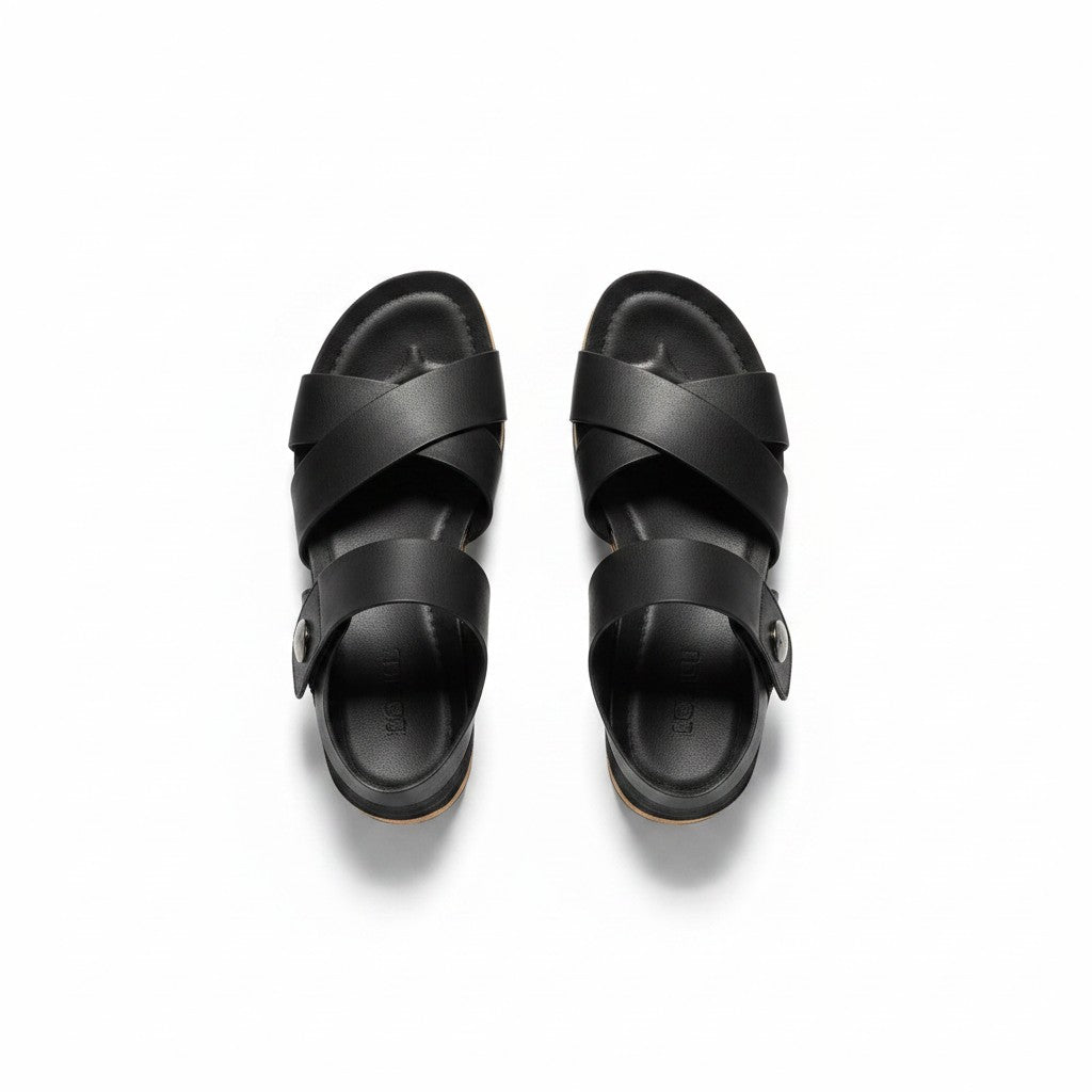 Pair of black sandals on a white background