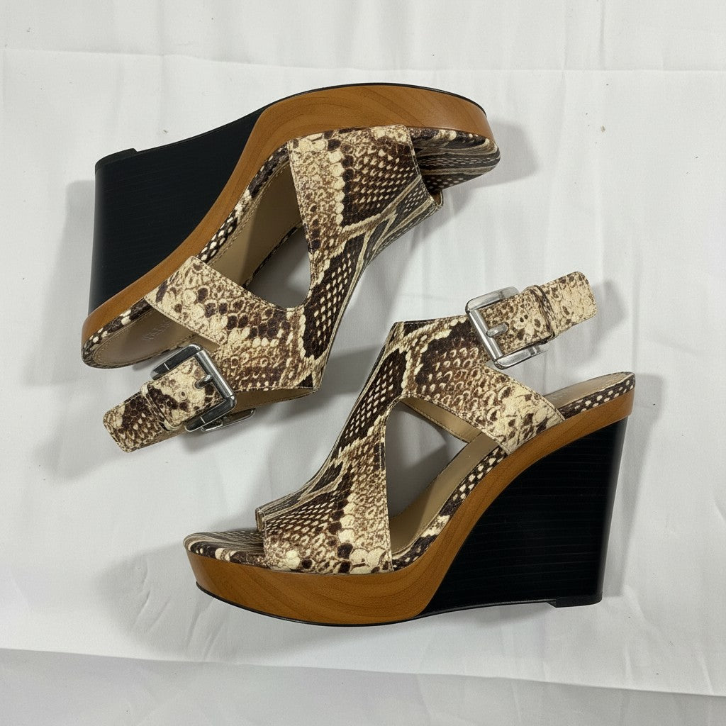 Snake print wedge sandals on a white background