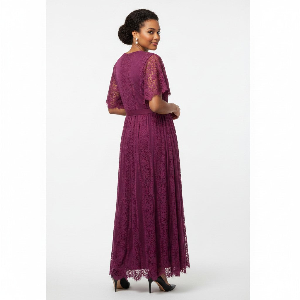 Woman wearing a purple lace dress on a white background
