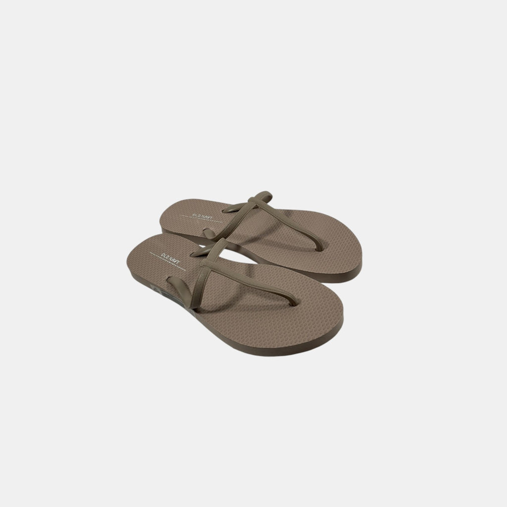 Pair of brown flip-flops on a white background