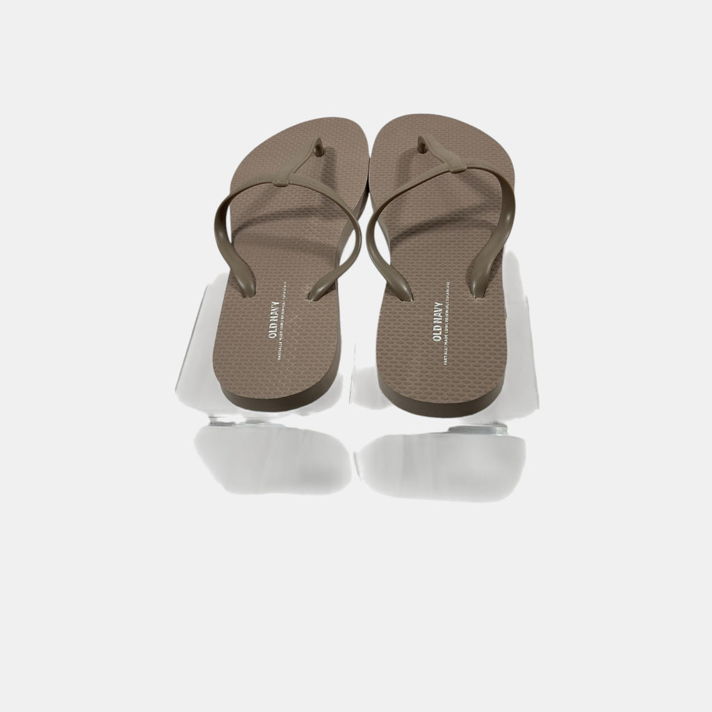 Pair of brown flip-flops on a white background