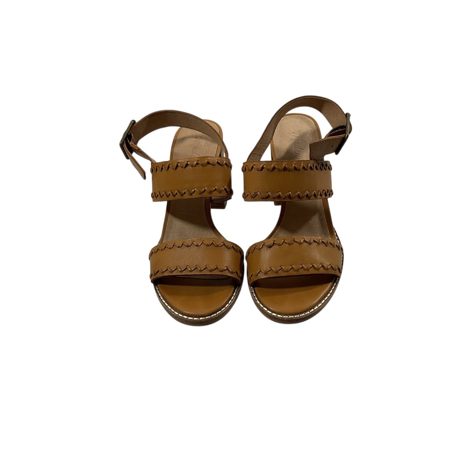 Pair of brown sandals on a white background