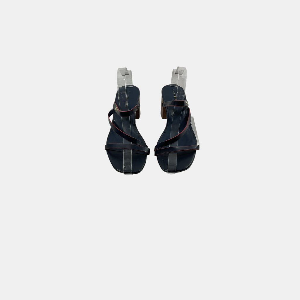 Pair of black high-heeled sandals on a white background