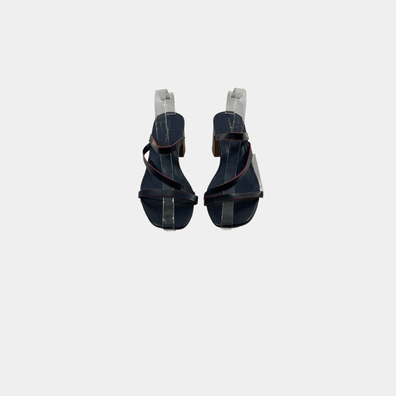 Pair of black high-heeled sandals on a white background