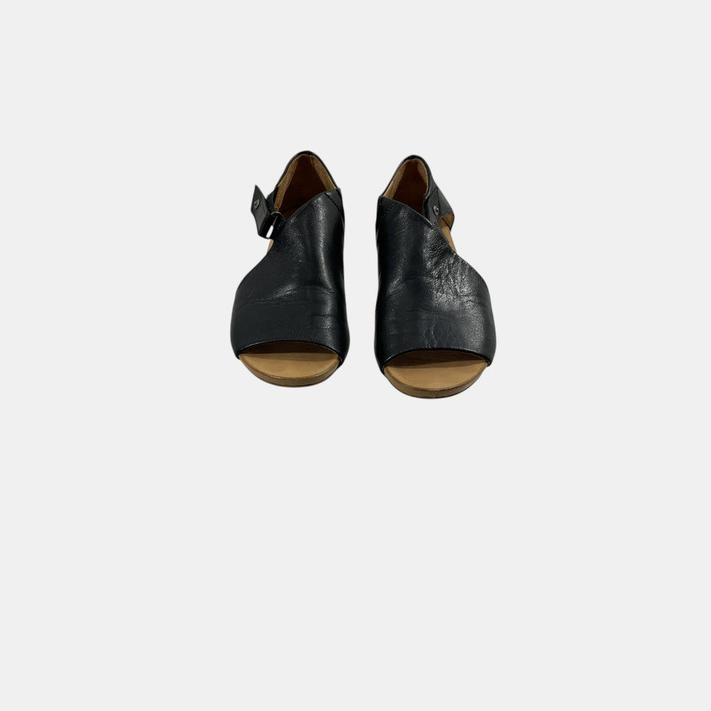 black snap close sandal on a white background
