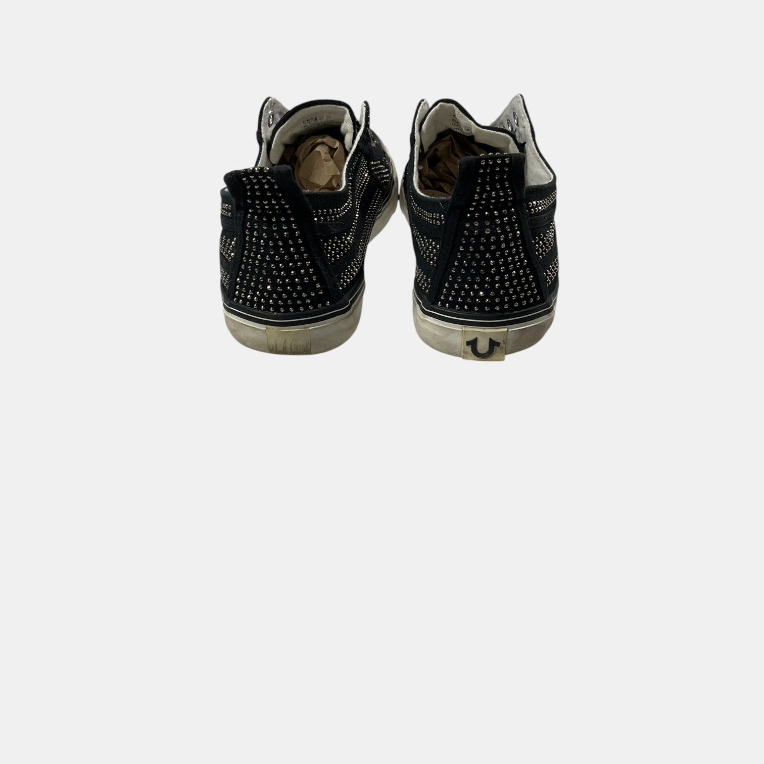 Black studded high-top sneakers on a white background
