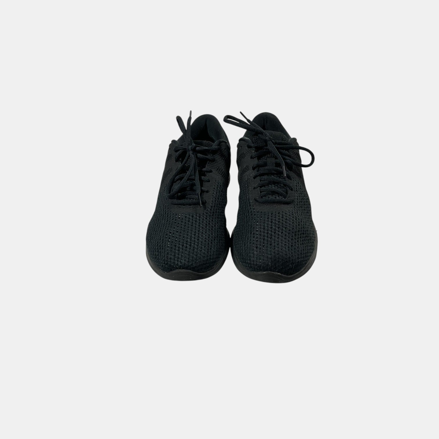 black Nike sneakers on a white background