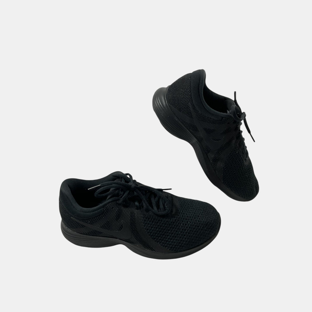 black Nike sneakers on a white background