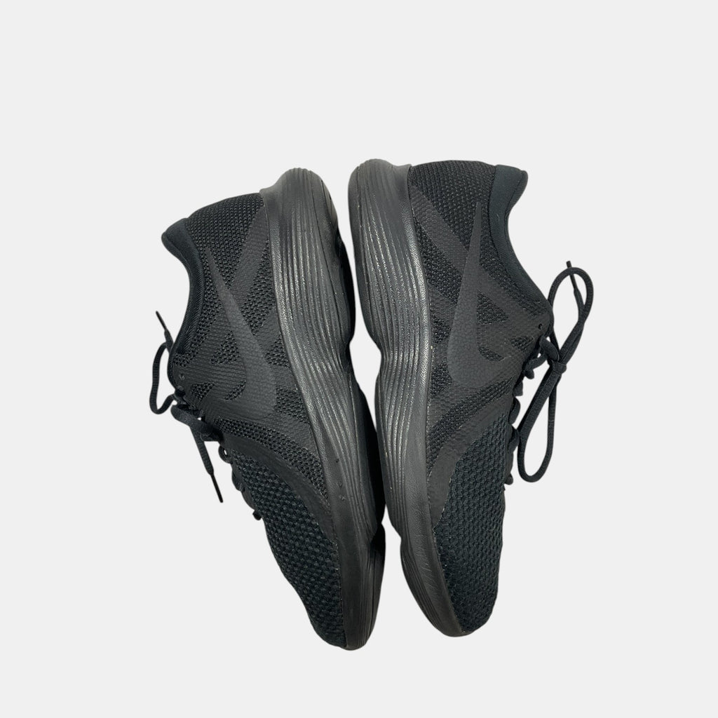 black Nike sneakers on a white background