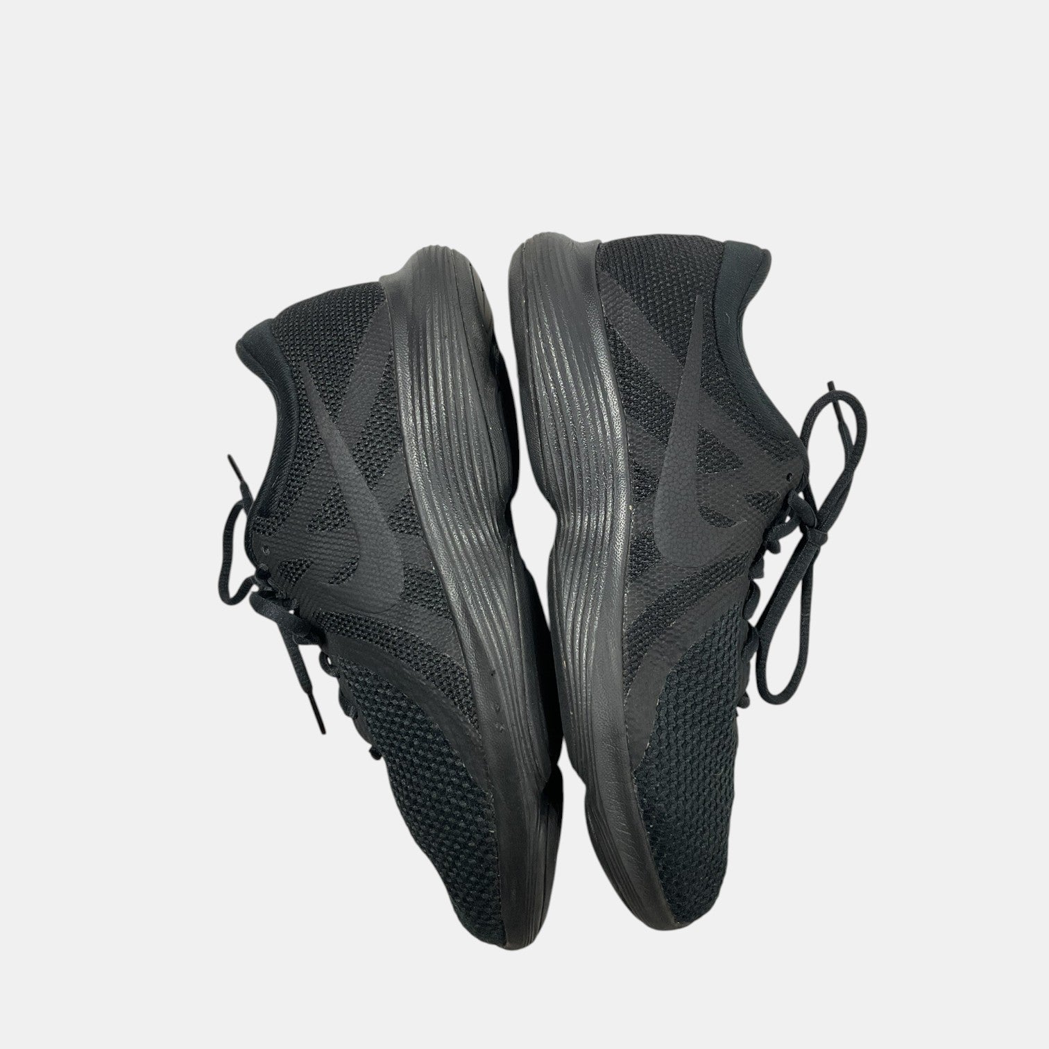black Nike sneakers on a white background