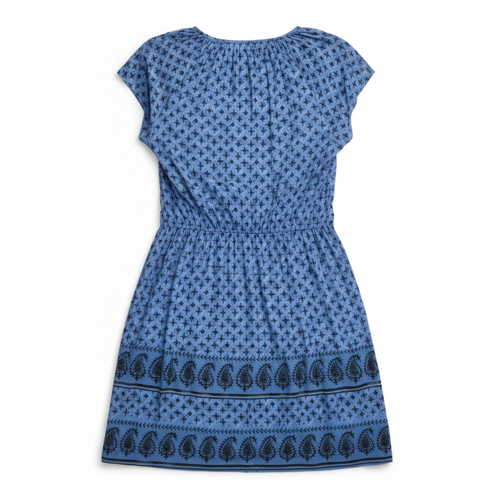 Blue patterned dress on a white background