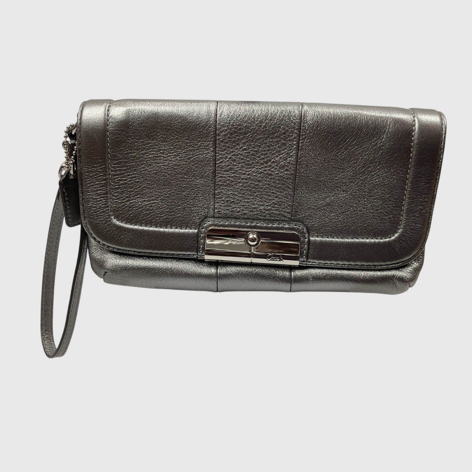A dark gray pebbled leather clutch bag with a wristlet strap and a silver-tone metal clasp, shown against a light gray background.