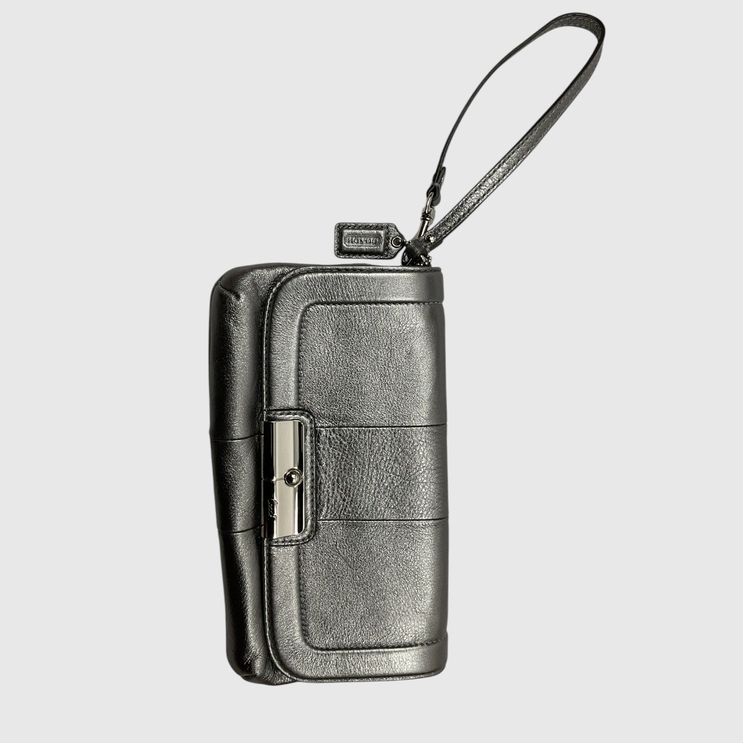 A black leather zip-around wallet with a wrist strap and silver-tone metal hardware, shown against a light gray background.
